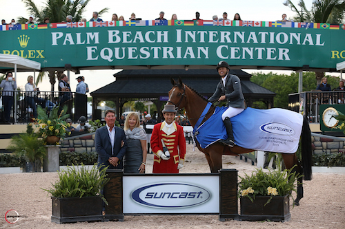 Kent Farrington and Waomi in their winning presentation with Tom and Jeannie Tisbo of Suncast® 