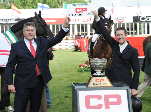 McLain Ward accepts his prize of $70,000 from Tim Marsh, Sr. Vice President, Sales & Marketing, Canadian Pacific