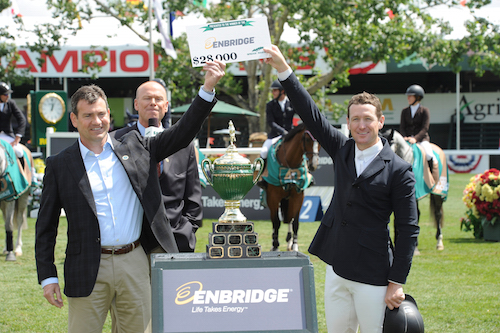 McLain Ward raises his winning check with Al Monaco, President & CEO, Enbridge Inc.