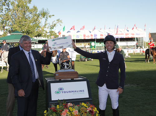 Kent Farrington accepts the winning prize from Mike Rose, Director & Chairman, President & CEO, Tourmaline Oil Corp