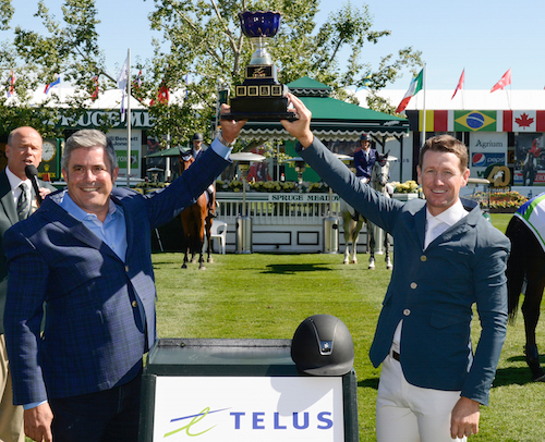 McLain Ward raises his winning trophy with Craig Mason, Vice President, Sales & Experience, Dealers & Channels, TELUS.