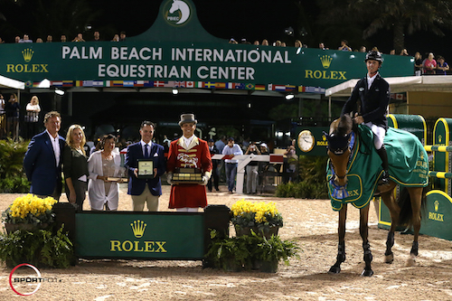 Ben Maher and Sarena in their winning presentation with Equestrian Sport Productions CEO Mark Bellissimo; Wellington Equestrian Partners Principal Katherine Bellissimo; Marsha Dammerman; Joel Aeschlimann, Head of Sponsorship, Rolex; and ringmaster Christian Craig.