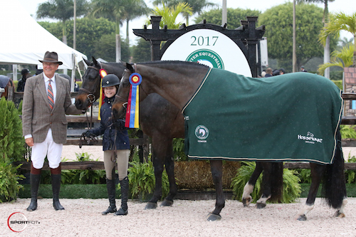 Sophie Gochman with champion Dominik, reserve champion Mythical, and ringmaster Steve Rector.