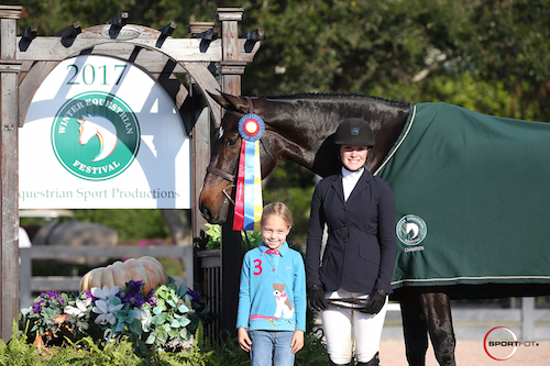 Emma Kurtz and Stellar in their championship presentation with Logan Orlando.