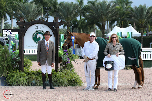 Fun in his championship presentation with ringmaster Steve Rector, __________, and Sally Stith Burdette of Shapley's Grooming Products.