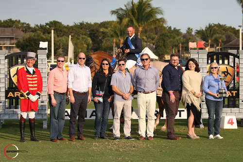 Todd Minikus and Babalou 41 in their winning presentation with ringmaster Steve Rector, Vice Mayor John McGovern, Councilman Michael Drahos, Councilwoman Tanya Siskind, Councilman Michael Napoleone, Equestrian Sport Productions CEO Mark Bellissimo, Chanse Huggins and Kasey Mowery of Ariat®, and Mayor Anne Gerwig presenting the Village of Wellington Cup.