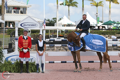 Todd Minikus and Zephyr in their winning presentation with ringmaster Steve Rector, and Lauren Tisbo of Suncast®.