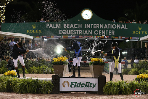 The top three celebrate with a champagne spray.