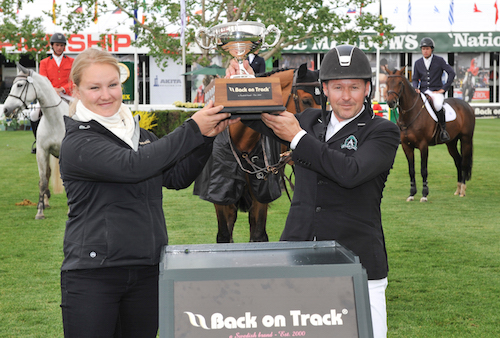 Eric Lamazes raises the Back on Track Cup with Tobi Simms, Vice President, Sales & Marketing, Back on Track.